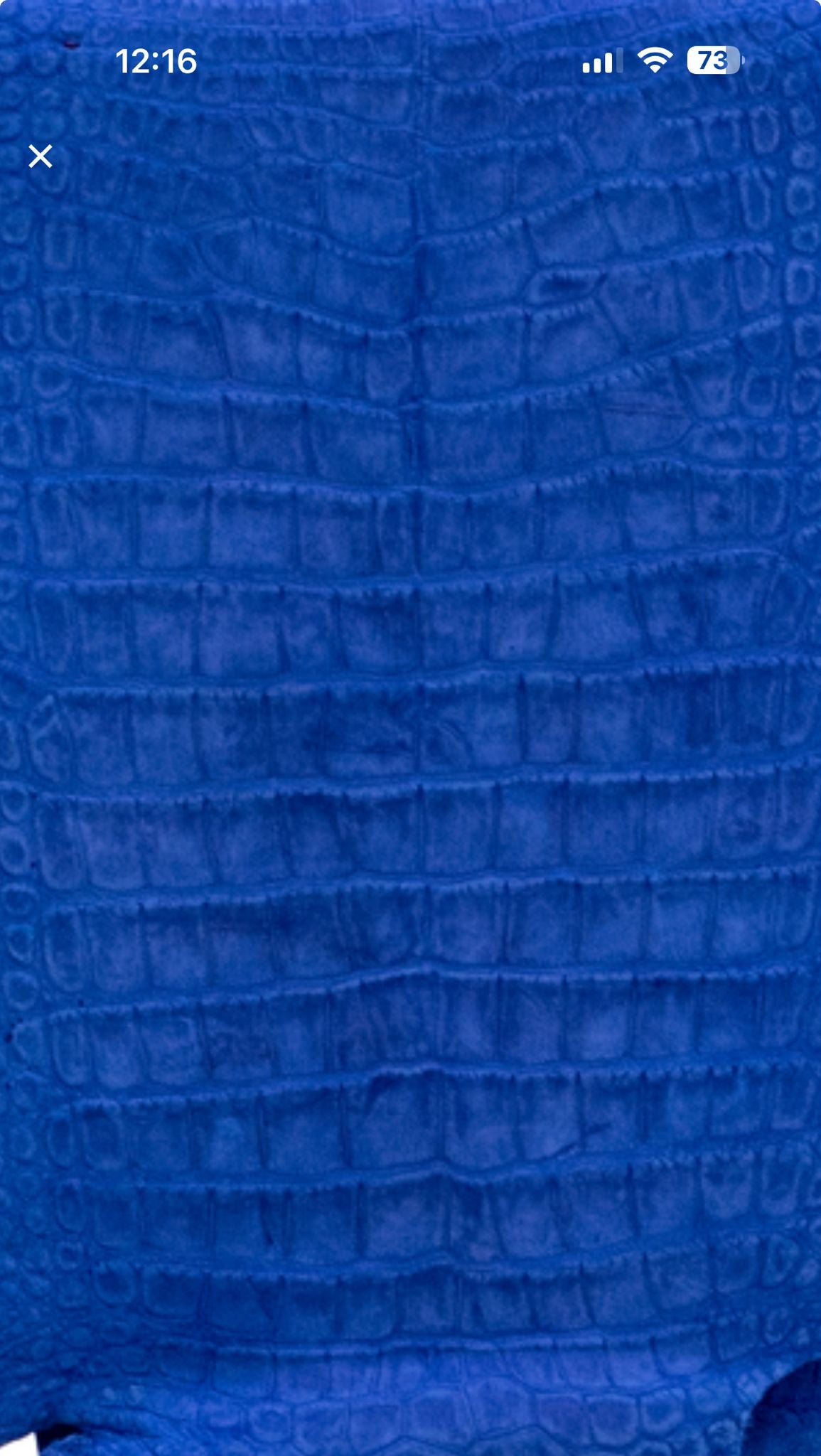 Dark blue genuine crocodile belly leather handbag by Rossie Viren, featuring a stylish and luxurious backpack design.