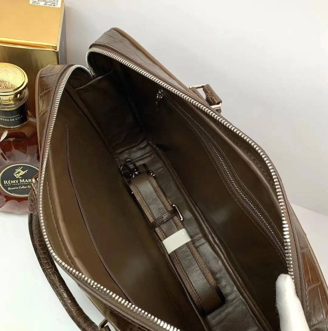 Large crocodile leather briefcase by Rossie Viren, showcasing a sleek, structured handbag with a textured crocodile pattern and sturdy handles.