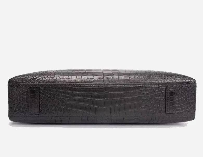 Crocodile leather briefcase with shoulder strap, password lock, and computer compartment, designed for business professionals.