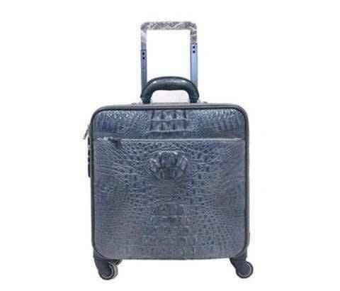 Genuine crocodile leather luxury luggage roller bag by Rossie Viren with sleek design and sturdy wheels.