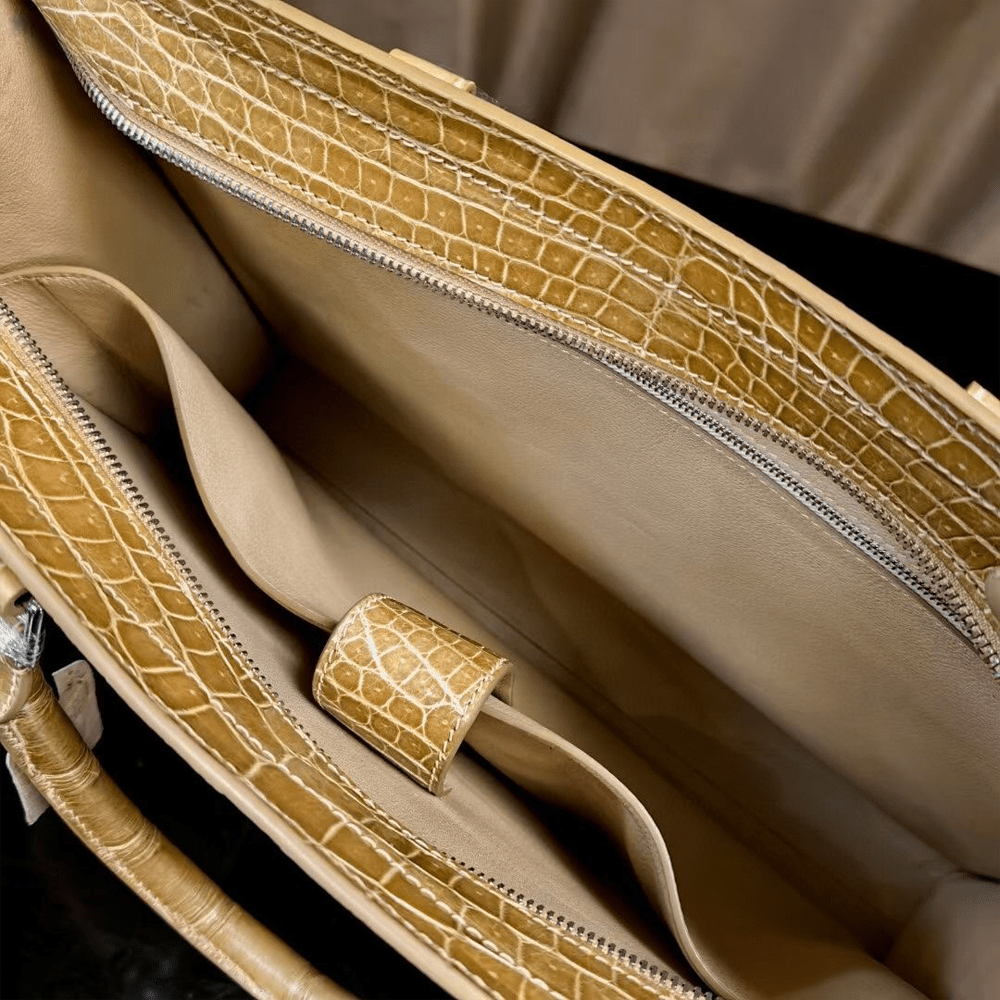 Rossie Viren crocodile skin leather briefcase with high gloss finish, designed for laptops and business use.