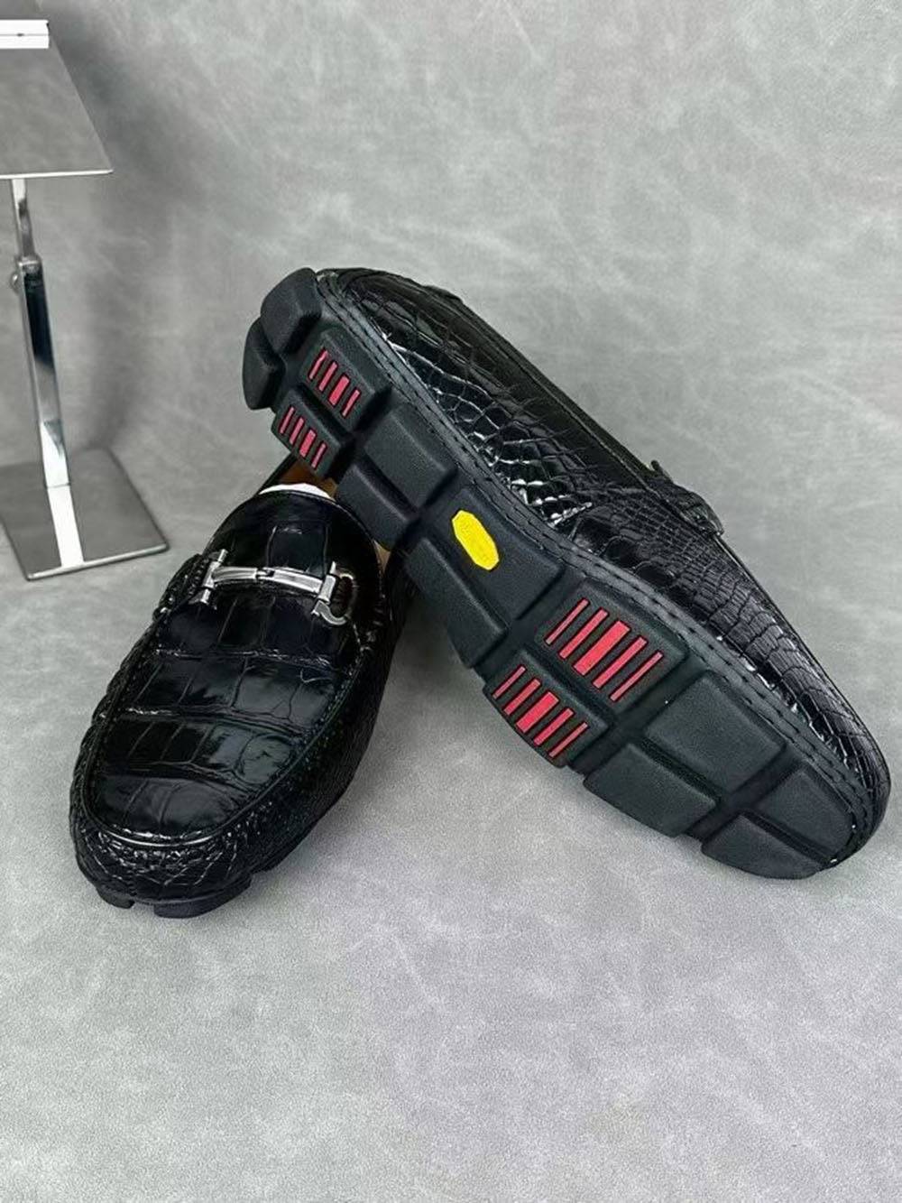 Black crocodile leather men's penny loafer dress shoe by Rossie Viren, showcasing textured crocodile pattern and sleek design.