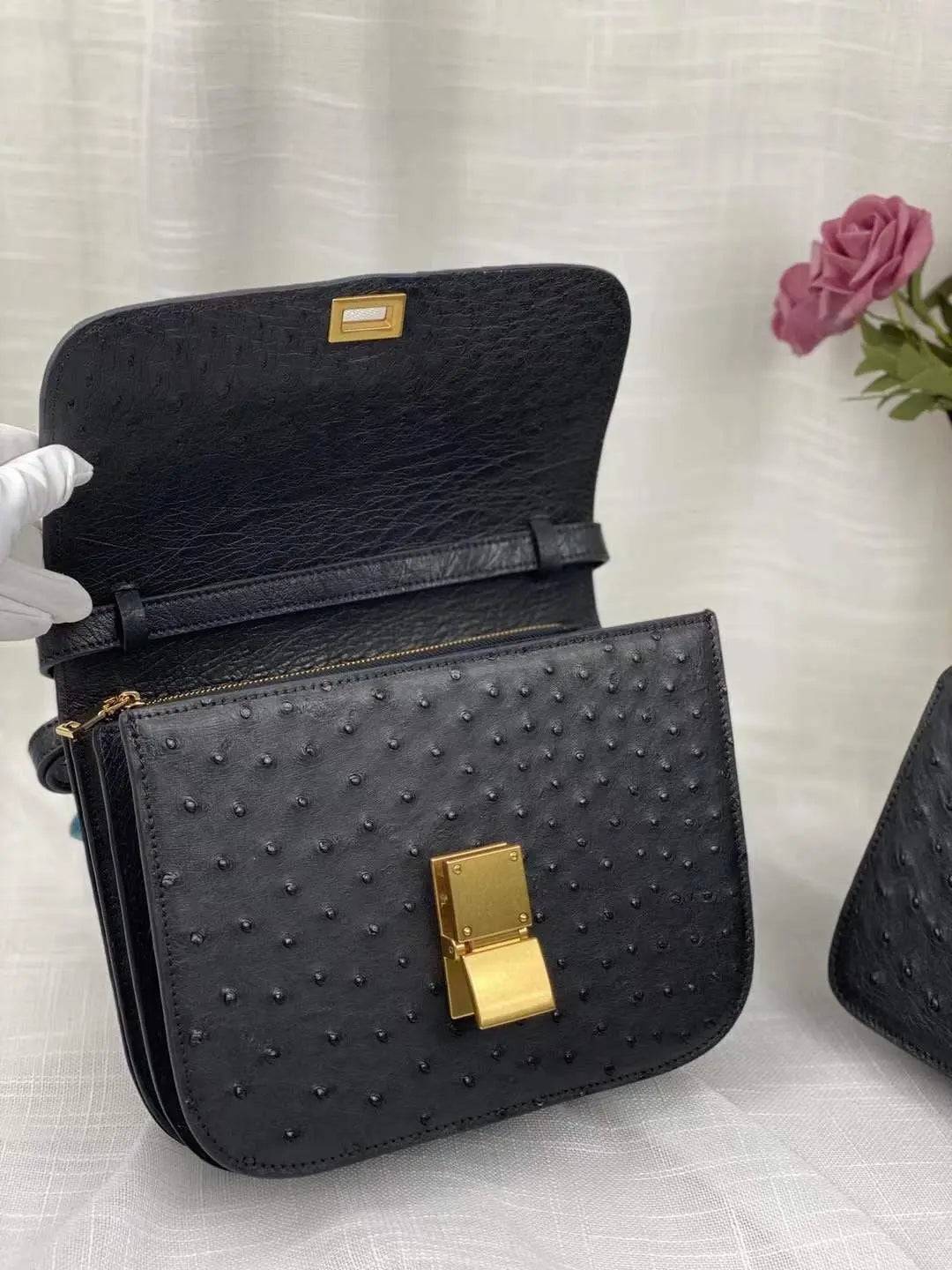 Women’s ostrich leather cross body messenger bag by Rossie Viren, featuring a sleek shoulder strap and textured leather finish.
