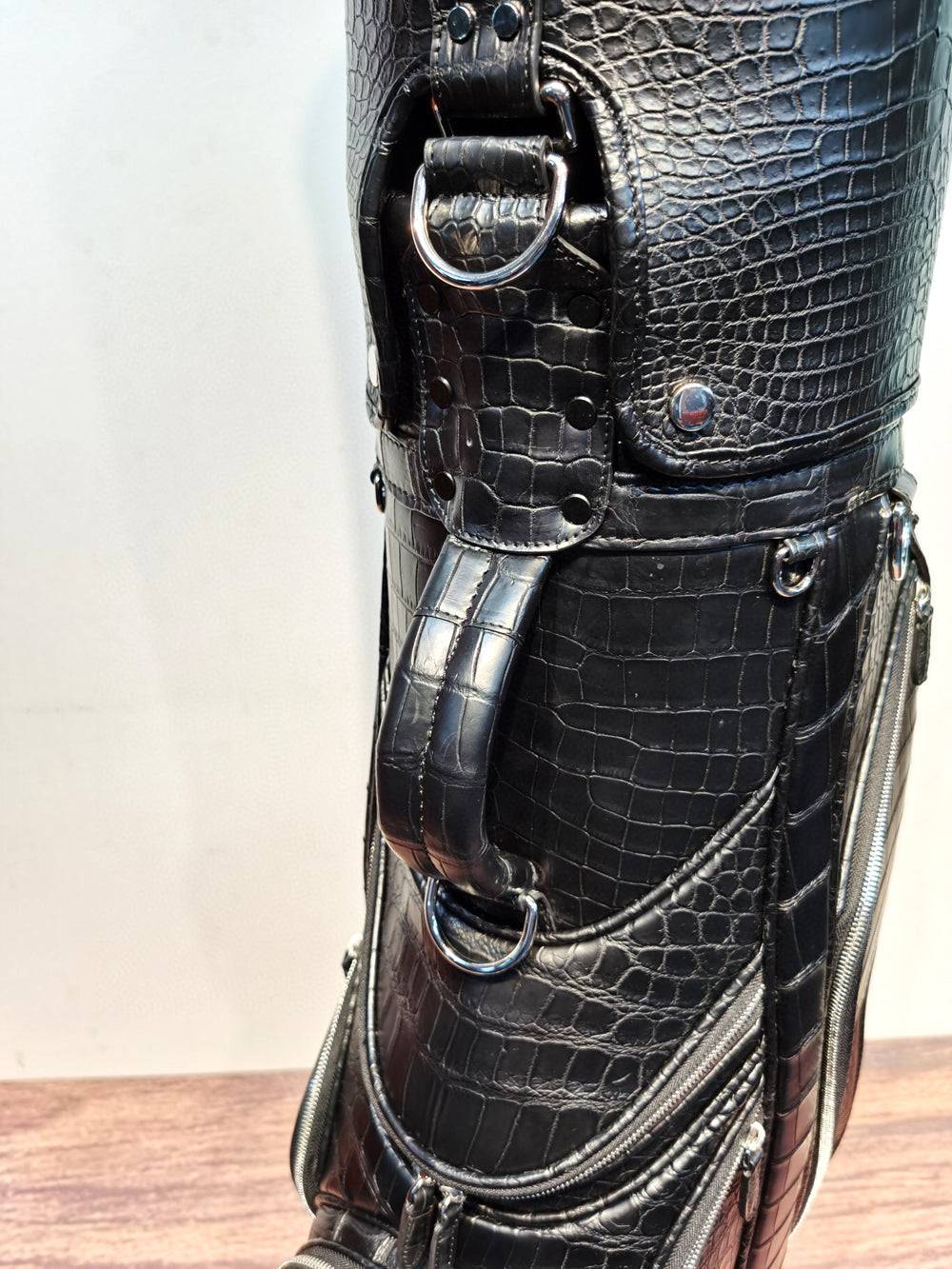 Black Crocodile Belly Leather Golf Bag set by Rossie Viren, includes cart, stand, and roller golf bags with textured crocodile pattern.