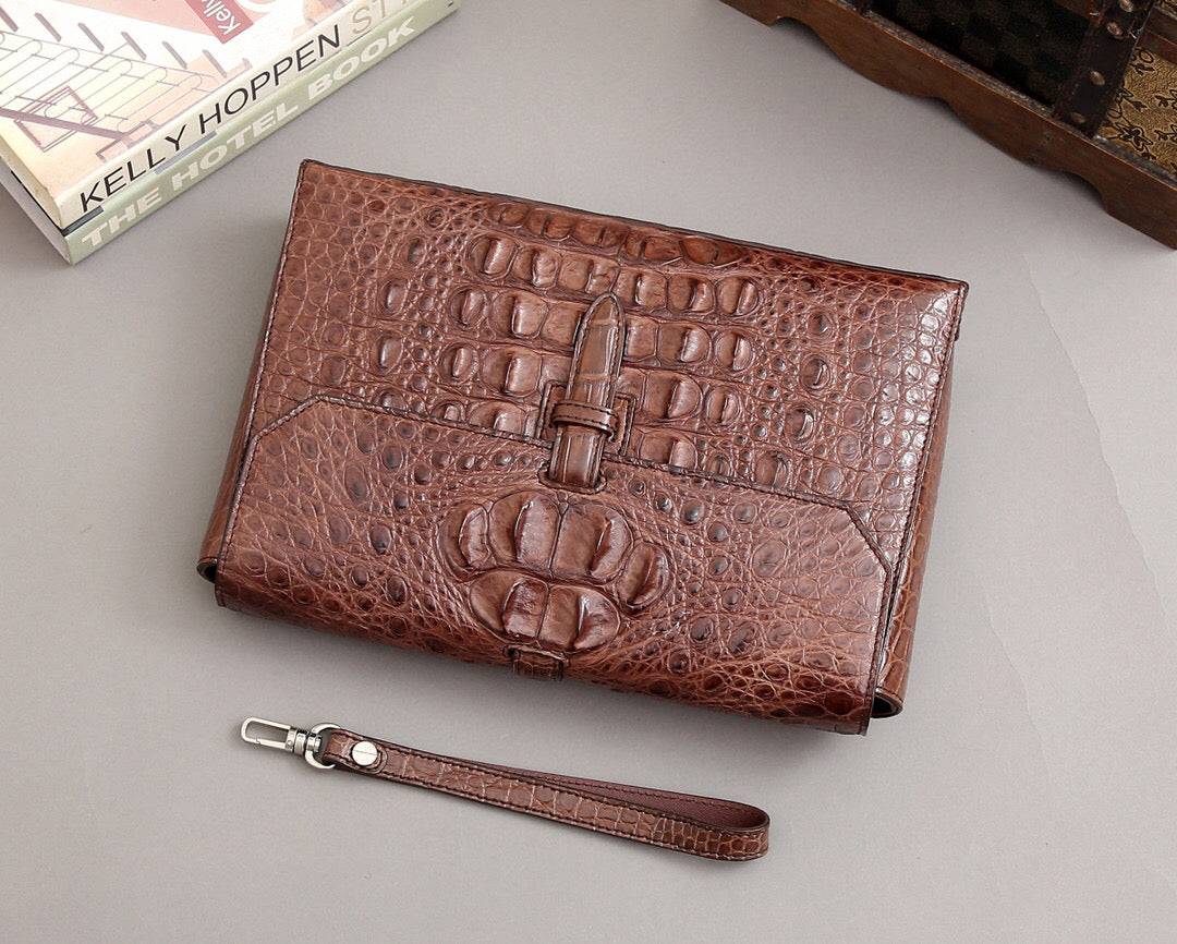 Rossie Viren crocodile bone leather clutch bag with sleek design and textured crocodile pattern for elegant style.