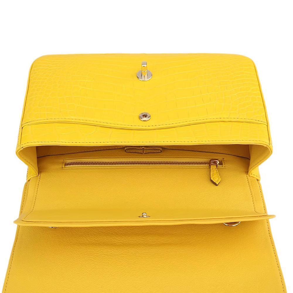 Yellow crocodile leather shoulder handbag with classic flap and chain strap by Rossie Viren for women.