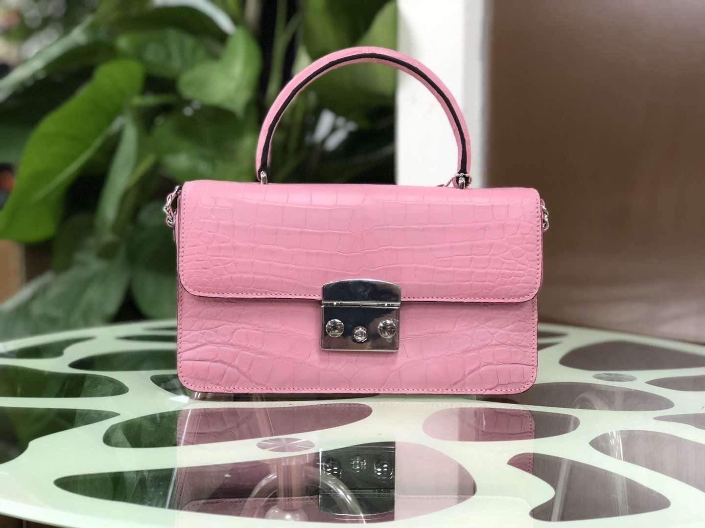 Rossie Viren crocodile leather cross body messenger handbag with top handle and sleek design, showcasing textured crocodile pattern.