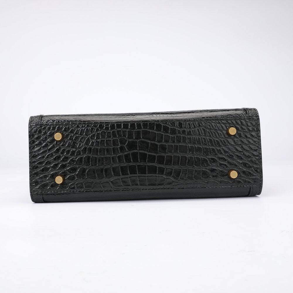 Rossie Viren crocodile leather micro top handle crossbody handbag showing textured crocodile skin and sleek design.