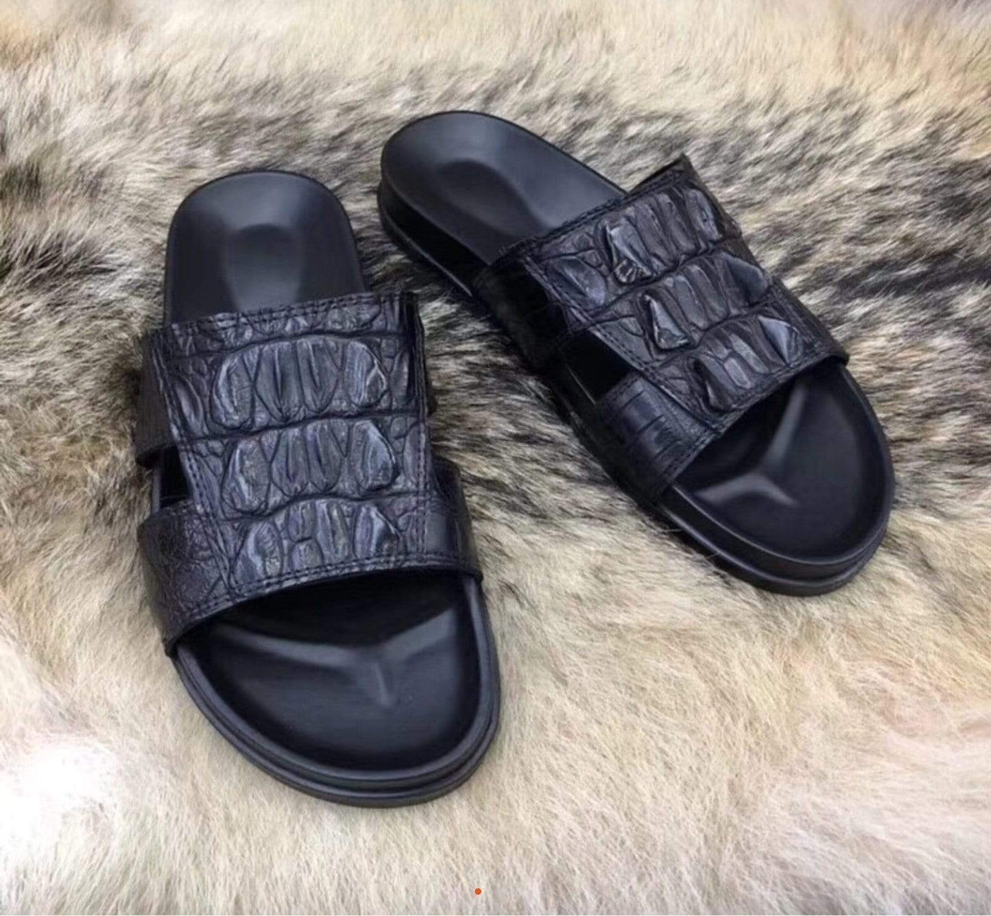 Genuine crocodile leather men's slipper by Rossie Viren with crocodile bone details and classic slip-on design.
