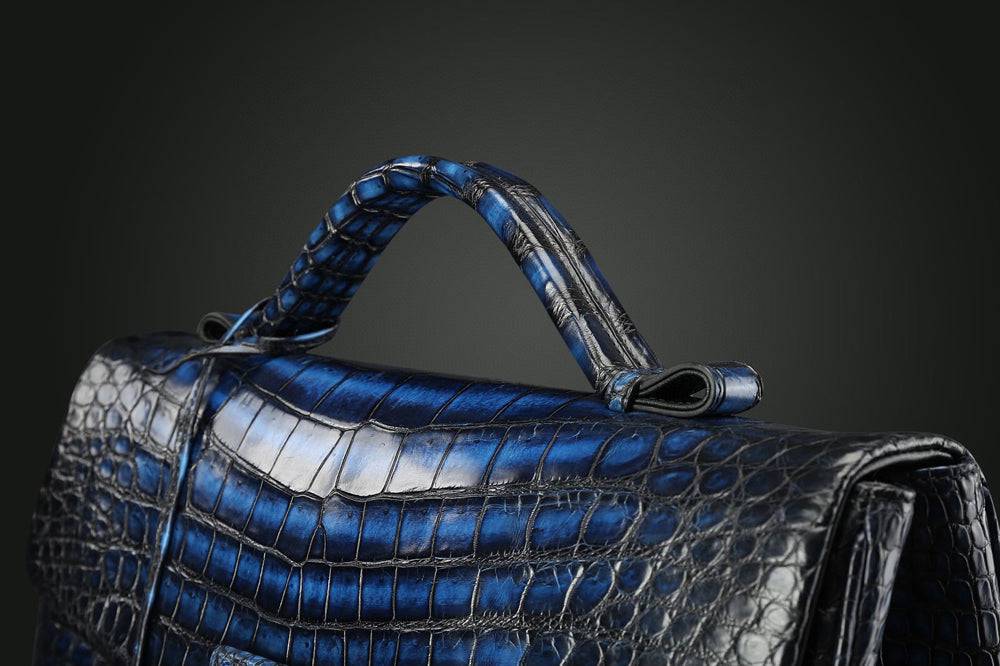 Vintage brown genuine crocodile leather briefcase by Rossie Viren, featuring a sleek, professional handbag design with textured leather.