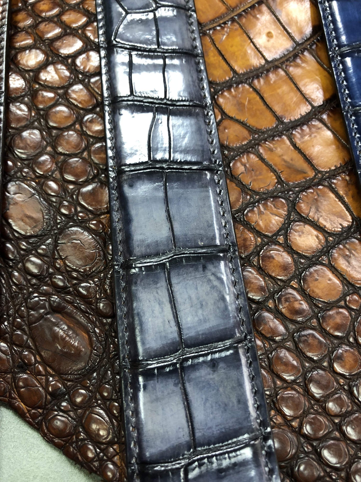 Hand-painted genuine crocodile leather belt by Rossie Viren, featuring intricate natural texture and craftsmanship.