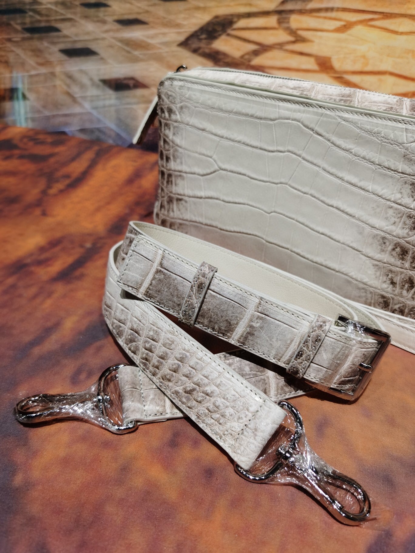 Rossie Viren Himalaya White crocodile skin leather backpack with shoulder, chest, and crossbody styles, stylish and luxurious.