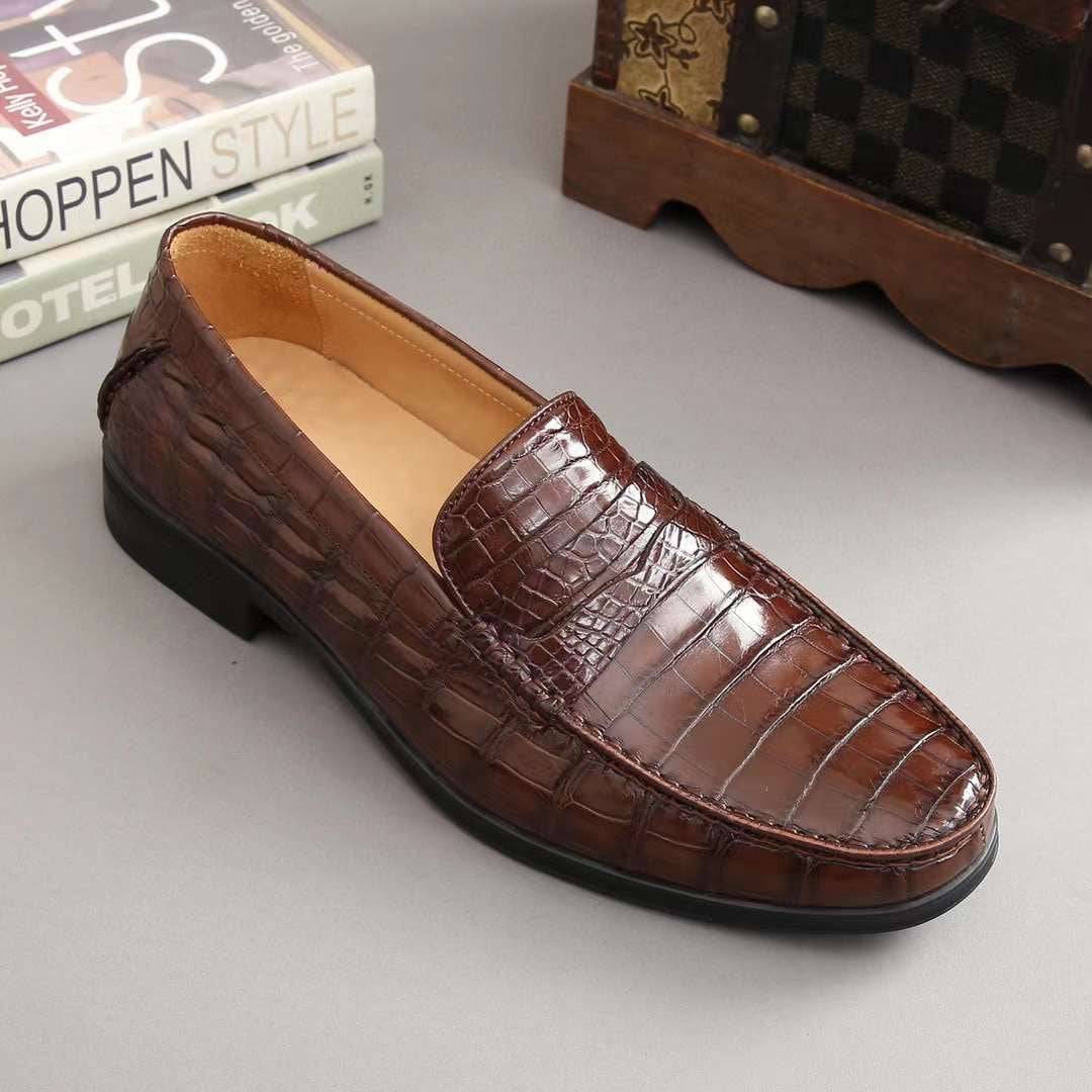 Men's crocodile leather slip-on loafers by Rossie Viren, featuring a sleek design and textured crocodile pattern.