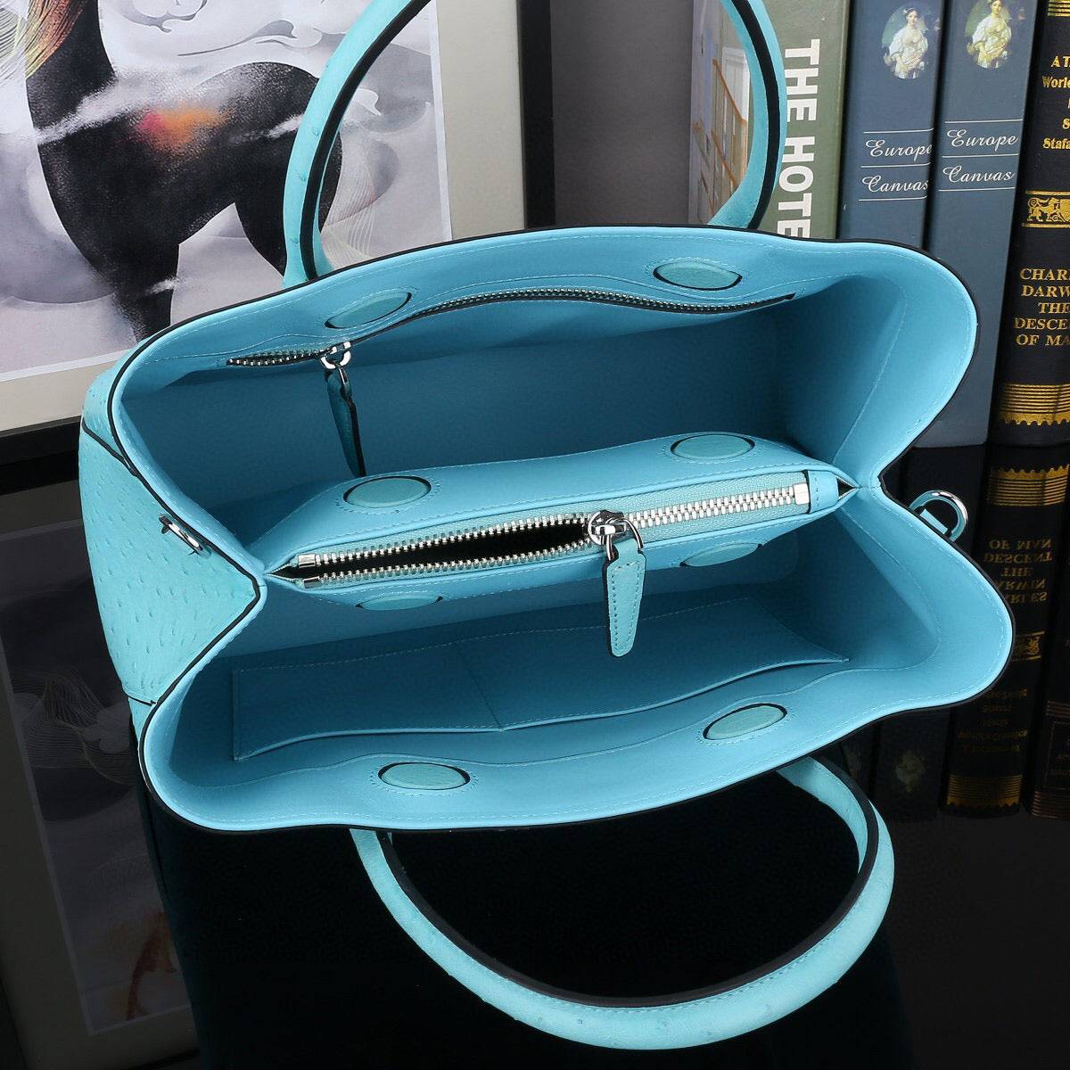 Blue ostrich leather top handle shoulder bag by Rossie Viren, 32cm handbag with elegant design and textured finish.