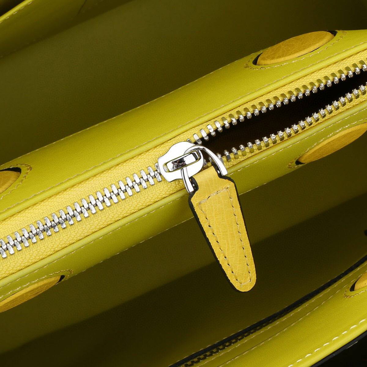 Yellow Rossie Viren ostrich leather top handle shoulder bag, 32cm handbag with a stylish design and textured leather finish.