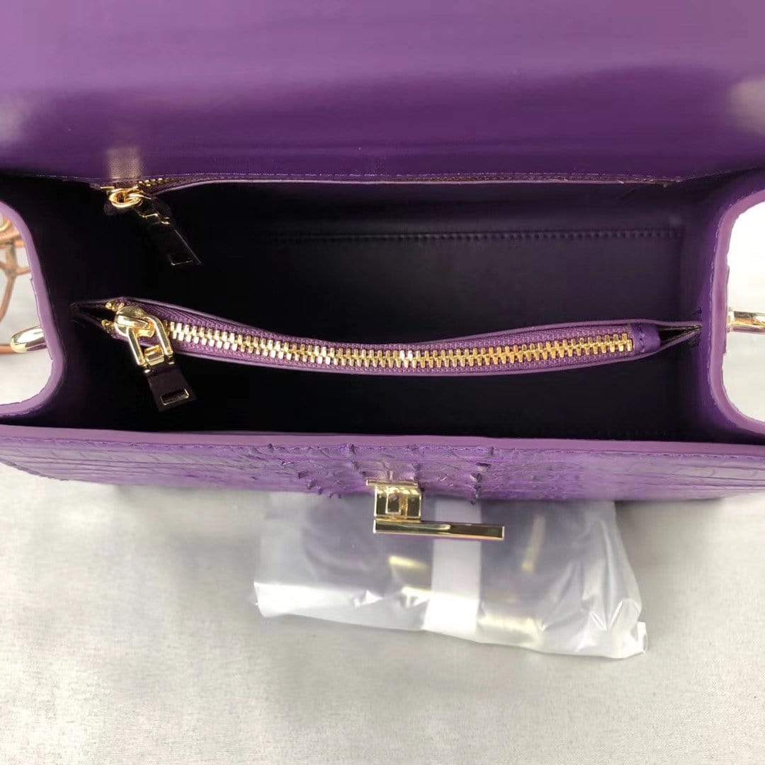 Purple crocodile leather top handle handbag for women by Rossie Viren, featuring a sleek and elegant design.