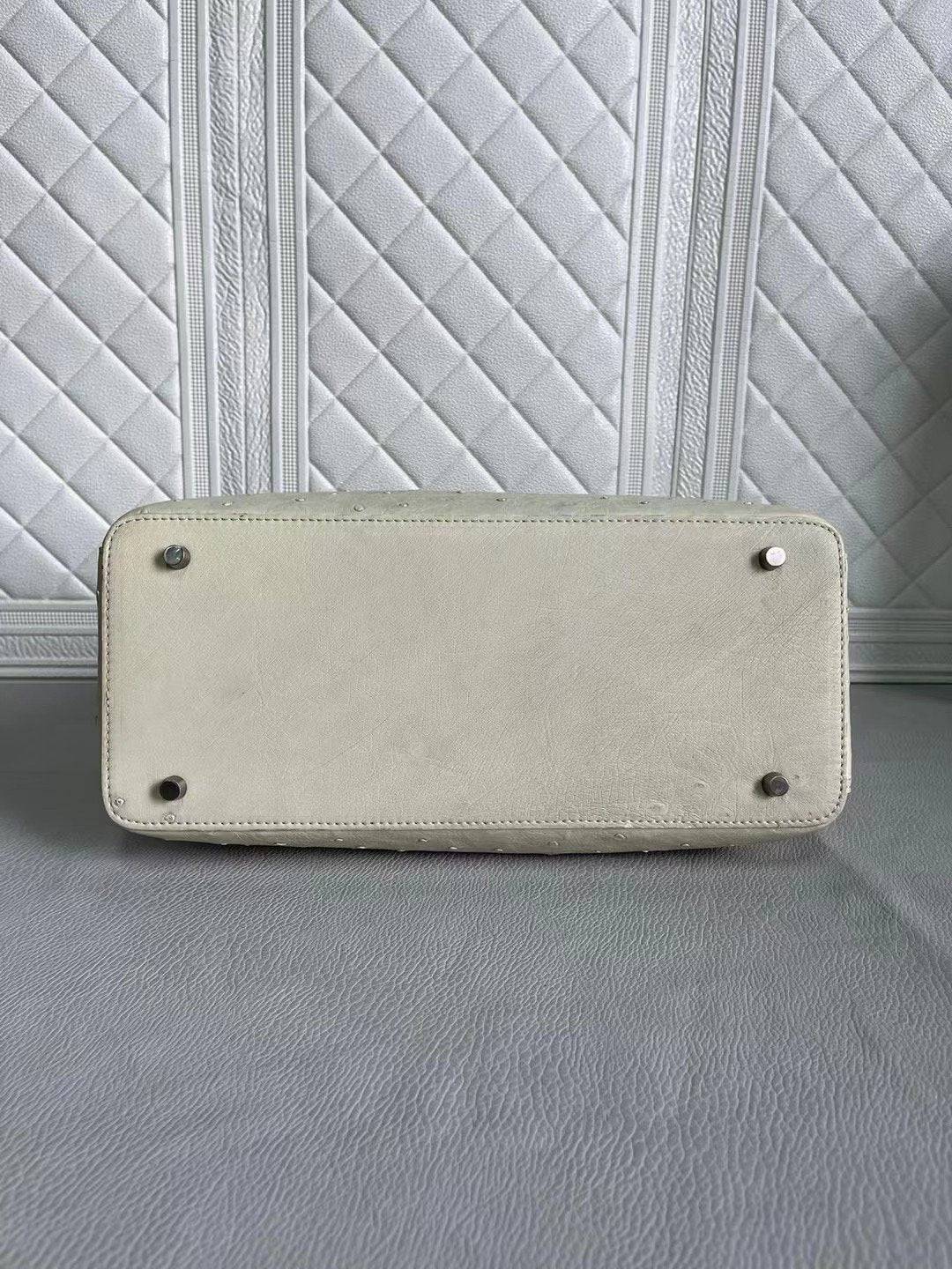 Rossie Viren women's ostrich leather handbag with blue and cream top handle, shoulder, and crossbody strap, 33cm size.