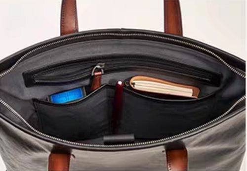 Black Rossie Viren 15-inch Togo leather laptop briefcase bag with top handles and sleek design.