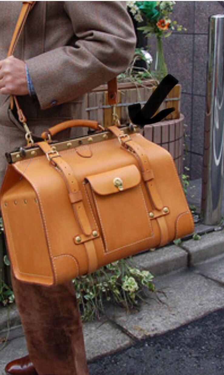 Rossie Viren crocodile leather large top handle satchel bag, showcasing its elegant design and textured crocodile pattern.
