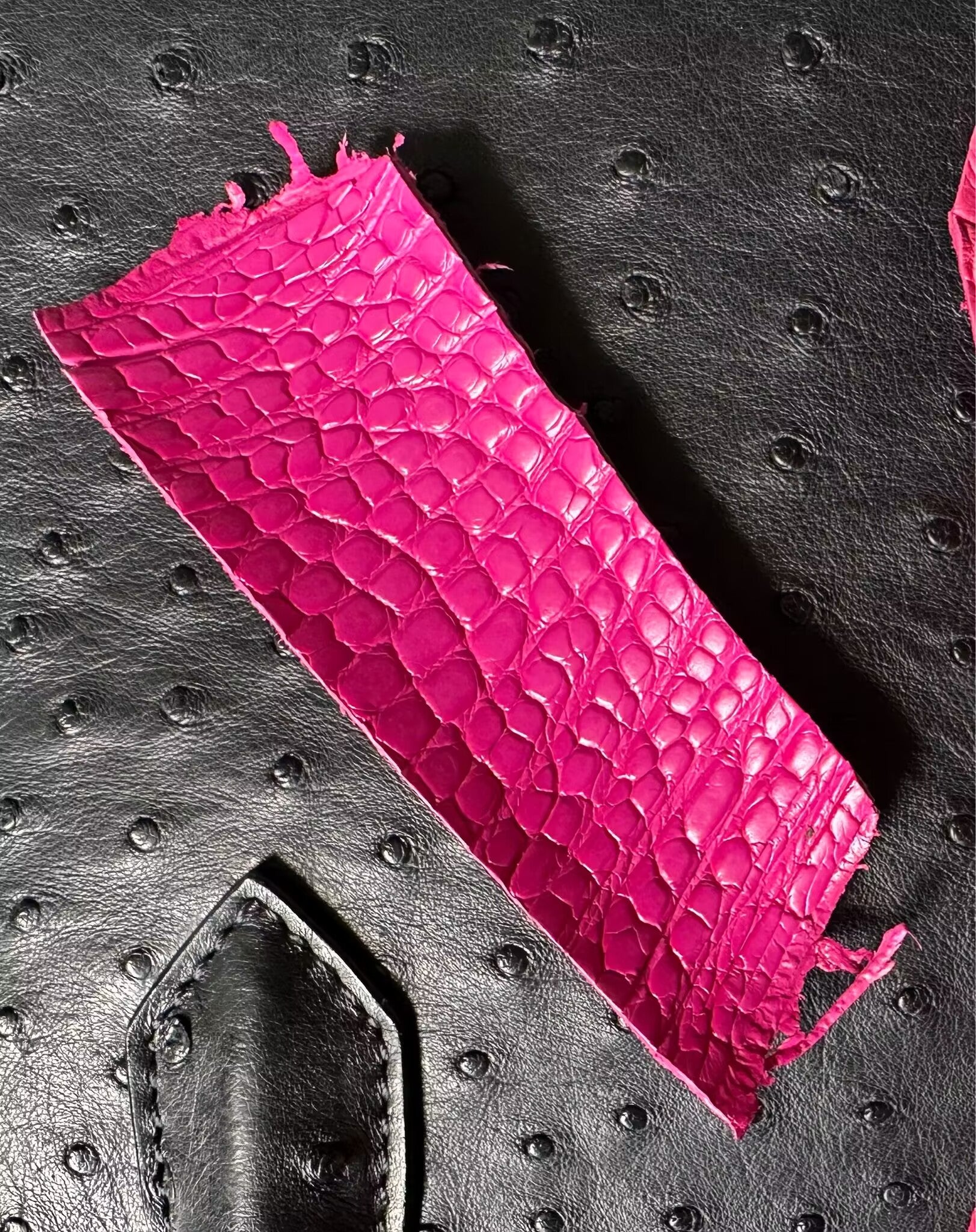 Hot pink crocodile skin leather mini flap chain handbag with top handle and crossbody strap by Rossie Viren.