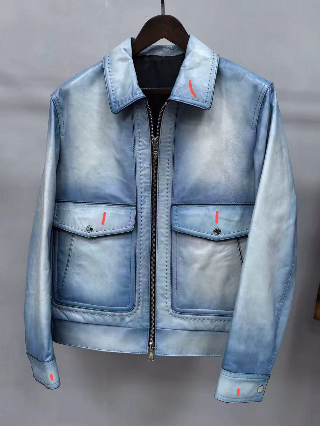 Vintage blue leather men's jacket by Rossie Viren showing a classic leather jacket with a sleek fit and stylish collar.
