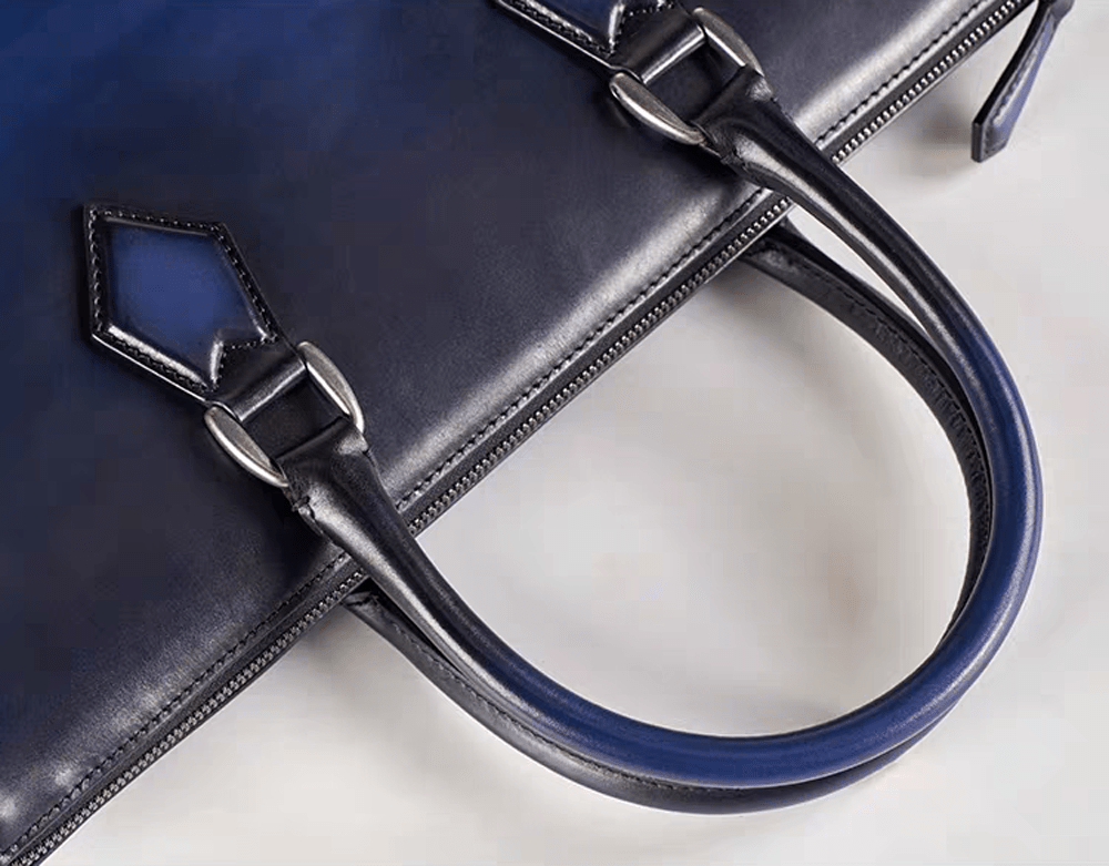 Vintage 14-inch leather laptop briefcase handbag by Rossie Viren, featuring classic design and sturdy handle.
