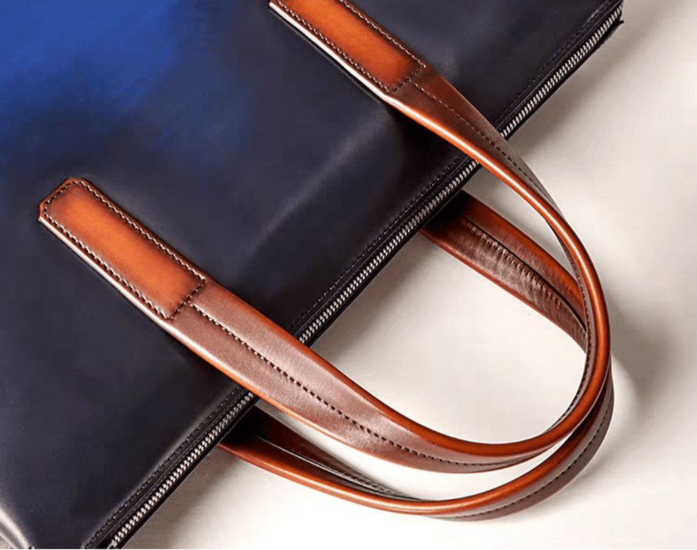 Vintage 15-inch leather laptop briefcase handbag by Rossie Viren, showing classic design and sturdy leather construction.