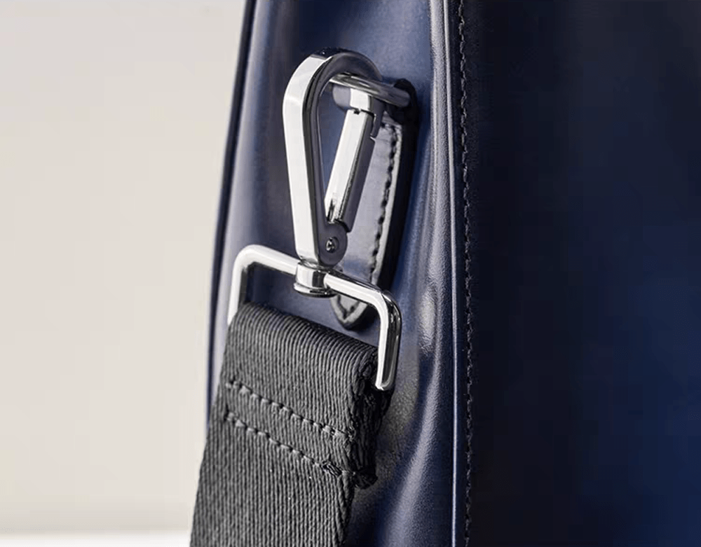 Vintage 14-inch leather laptop briefcase handbag by Rossie Viren, featuring a classic design and sturdy handles.