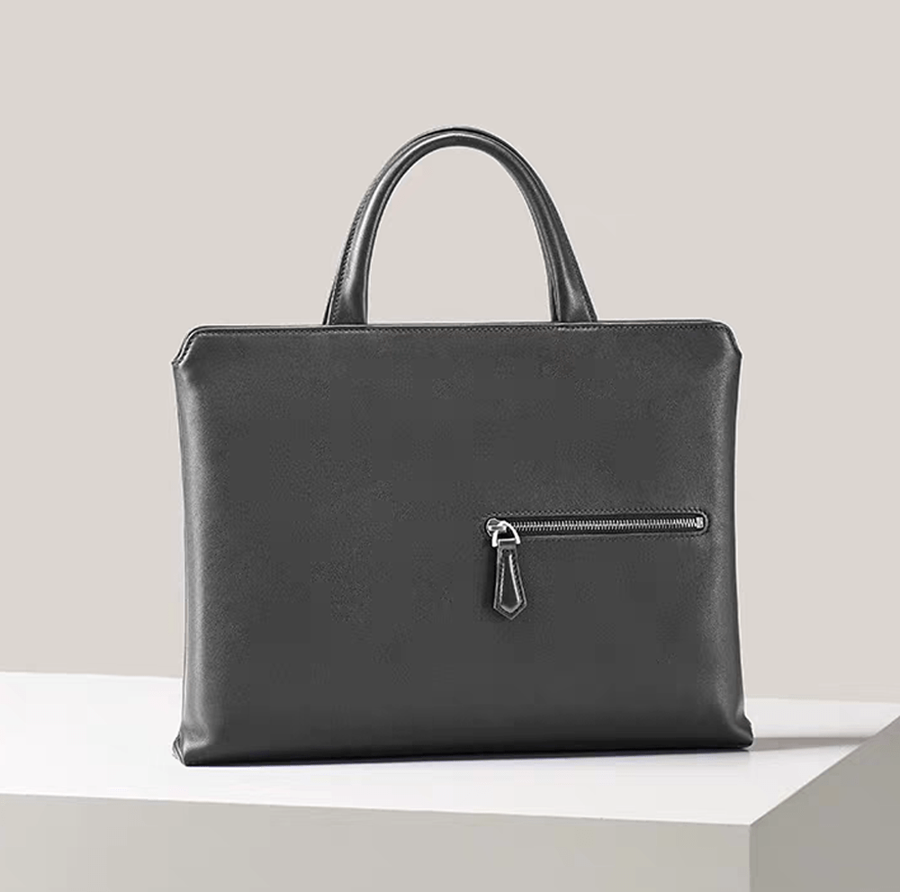 Black 14-inch imported grainy leather laptop briefcase bag by Rossie Viren, showcasing a classic handbag design with sturdy handles.