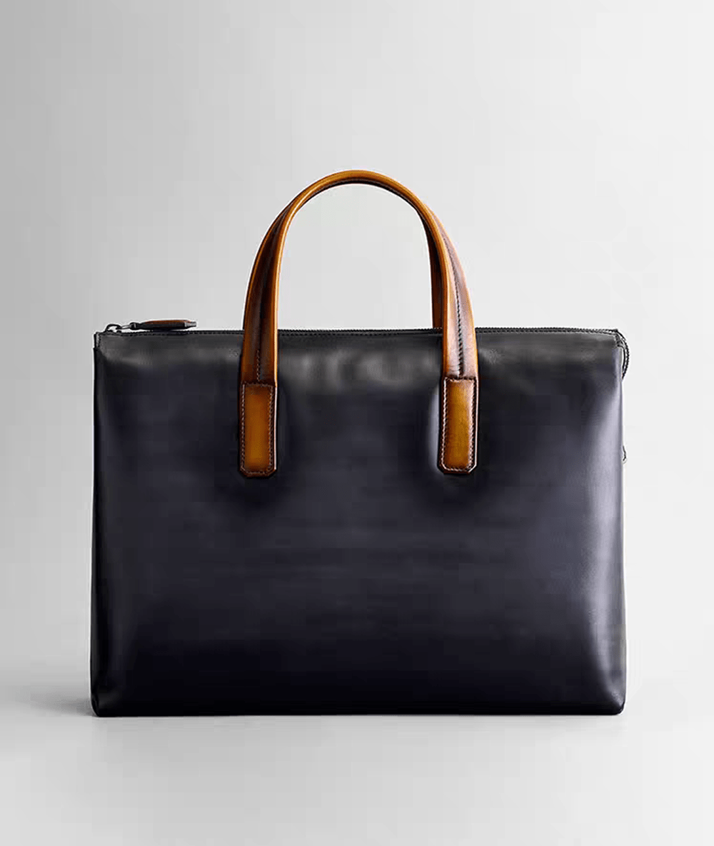Vintage 15-inch leather laptop briefcase handbag by Rossie Viren, featuring a classic design with sturdy leather straps and a top handle.