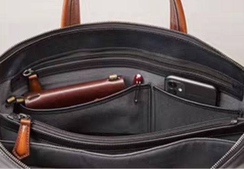 Vintage 15-inch leather laptop briefcase bag by Rossie Viren with sturdy handles and classic design, perfect for professional use.