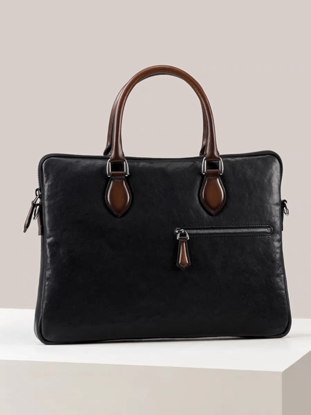 Black 15-inch Rossie Viren imported calfskin leather laptop briefcase bag with classic design and structured handbag style.
