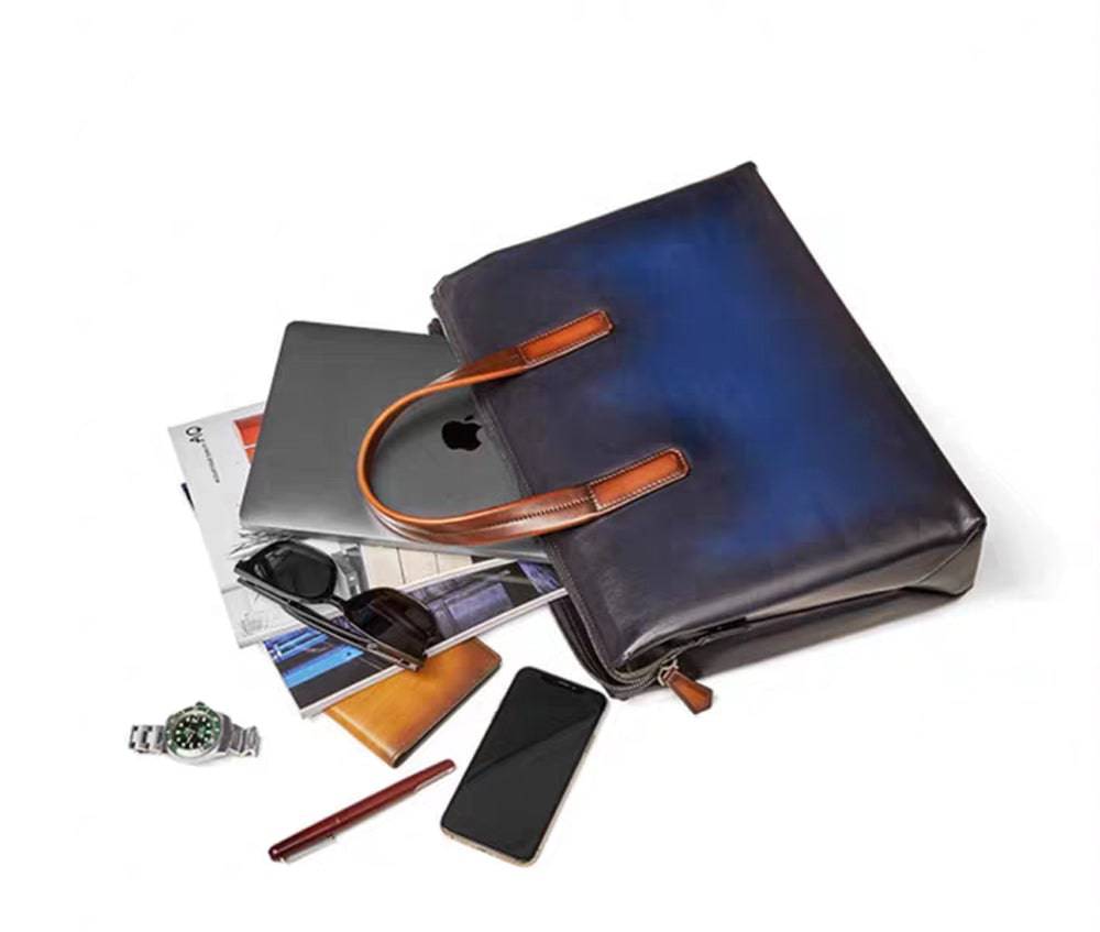 Vintage leather 15-inch Rossie Viren laptop briefcase bag with sturdy handles and classic design.