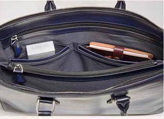 Vintage 14-inch leather laptop briefcase handbag by Rossie Viren, with sturdy handles and classic design, suitable for professional use.