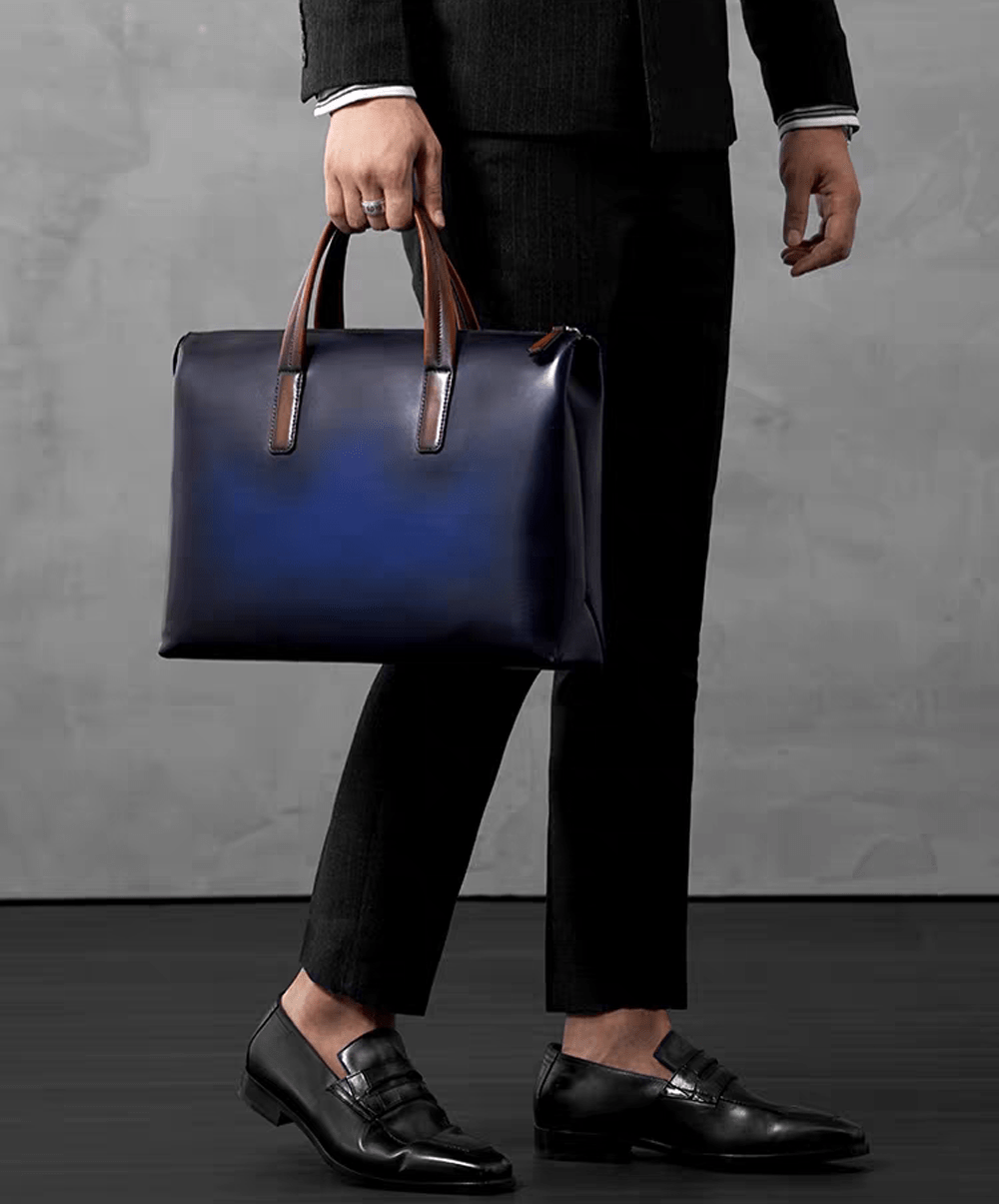 Vintage 15-inch leather laptop briefcase handbag by Rossie Viren, with sturdy handles and classic design for professional use.