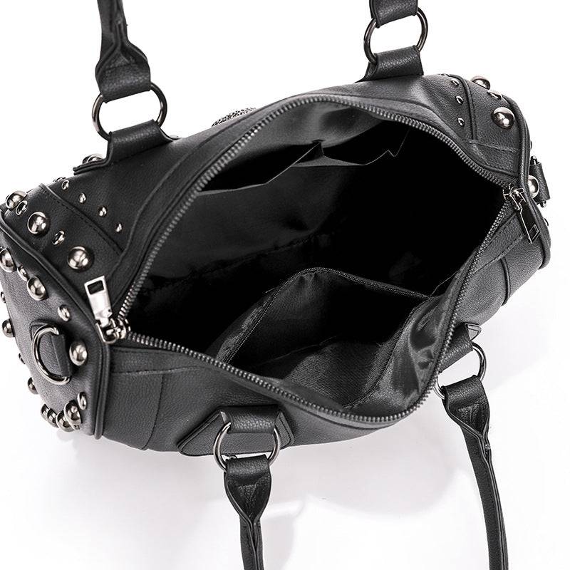 Rossie Viren 3D crystal skull shoulder bag with studded satchel design, featuring a detailed crystal skull embellishment and studded accents.