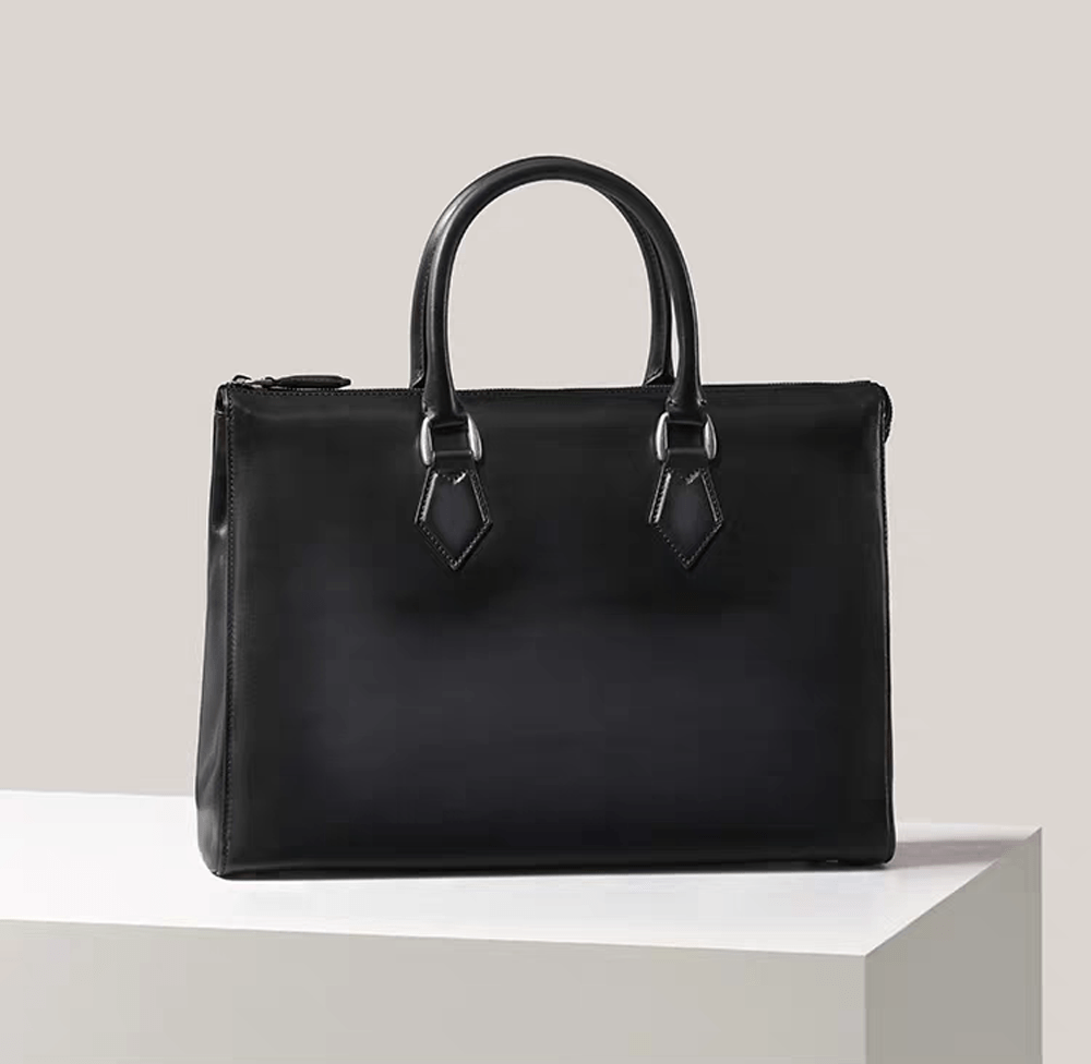 Vintage leather laptop briefcase bag by Rossie Viren, 14-inch imported handbag with classic design and sturdy handles.