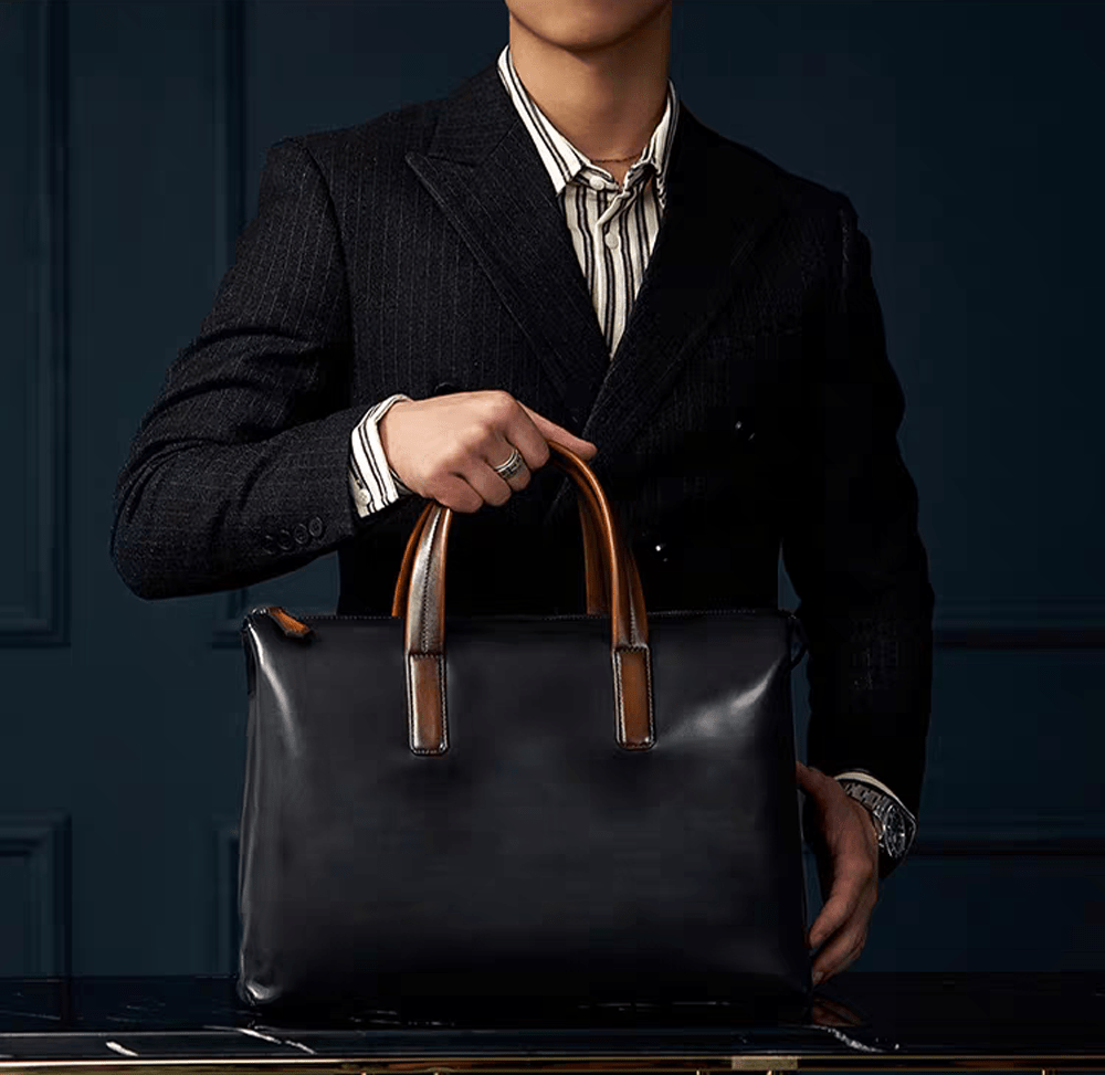 Vintage 15-inch leather laptop briefcase handbag by Rossie Viren, featuring a classic design with sturdy leather straps and a spacious interior.