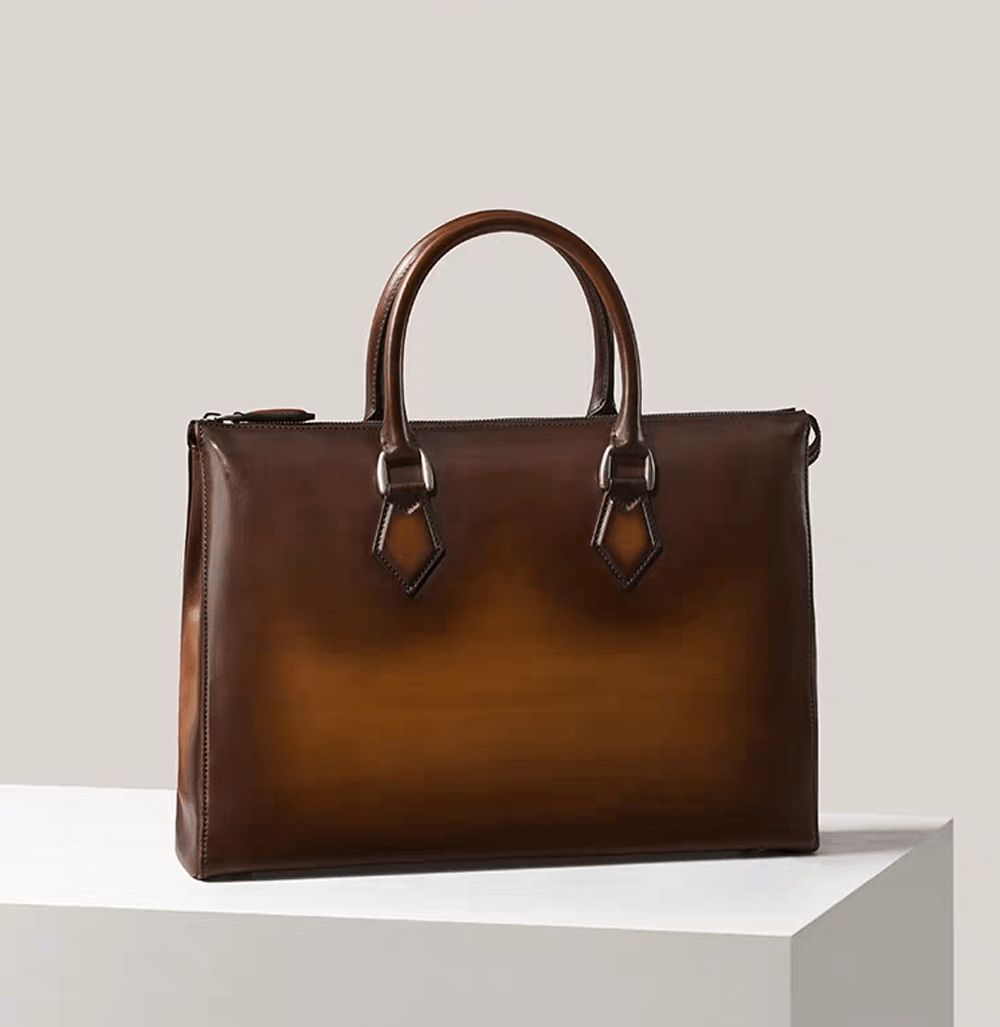 Vintage 14-inch leather laptop briefcase bag by Rossie Viren, featuring a classic handbag design with sturdy handles and imported leather.