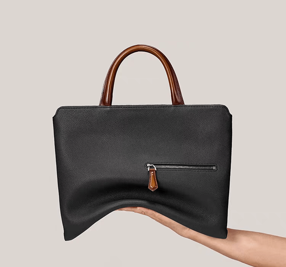 Black 14-inch imported grainy leather laptop briefcase by Rossie Viren, featuring a classic handbag design with sturdy handles.