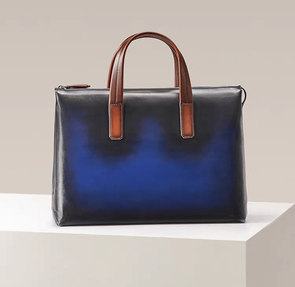 Vintage 15-inch leather laptop briefcase handbag by Rossie Viren, featuring classic stitching and sturdy leather handles.