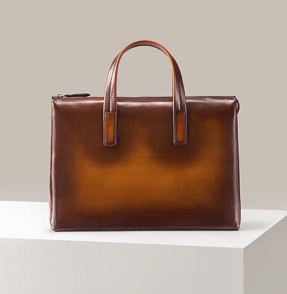 15-inch vintage leather laptop briefcase bag by Rossie Viren featuring a sturdy handle and classic design.