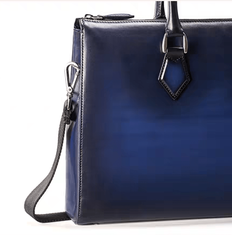 Vintage leather laptop briefcase bag by Rossie Viren, 14-inch imported handbag with sturdy handles and classic design.