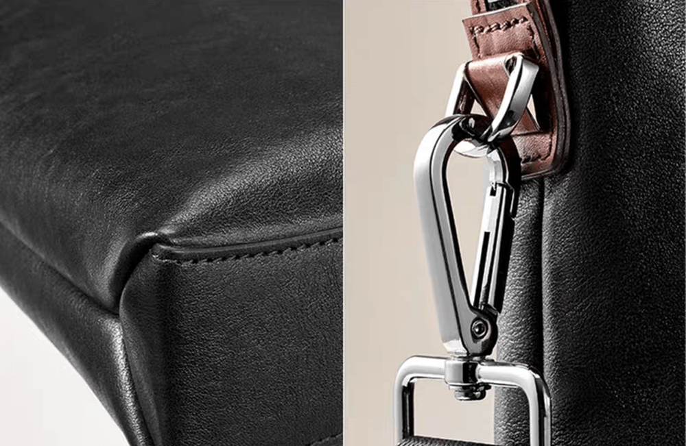 Black 15-inch Togo leather laptop briefcase handbag by Rossie Viren, featuring sturdy handles and sleek design.