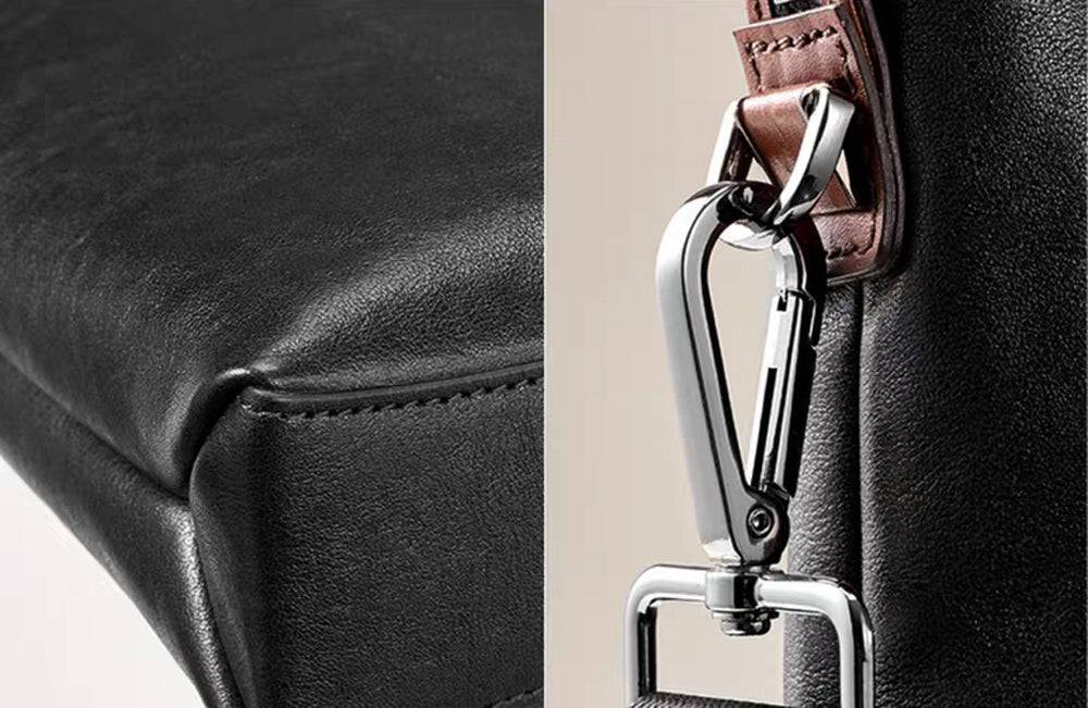 Black 15-inch Togo leather laptop briefcase bag by Rossie Viren, featuring a structured handbag design with sturdy handles.