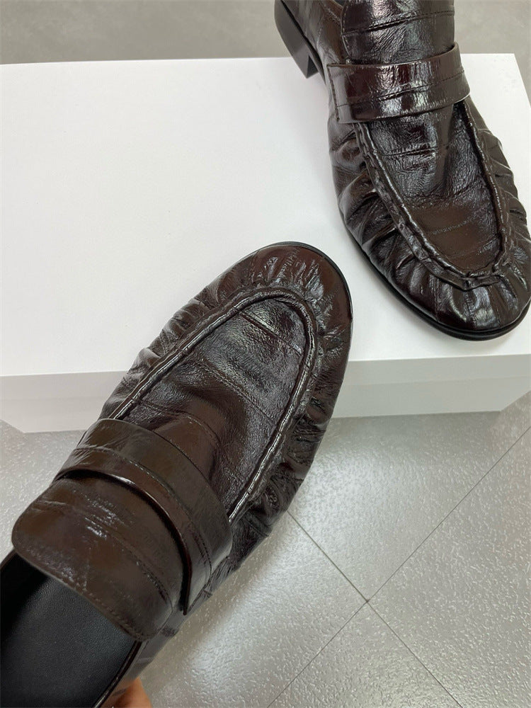 Eel skin loafers for women by Rossie Viren, showcasing stylish slip-on shoes with textured eel skin material.
