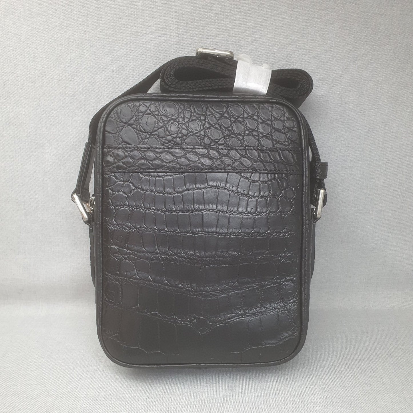 Rossie Viren crocodile leather small crossbody shoulder bag with sleek design and adjustable strap.