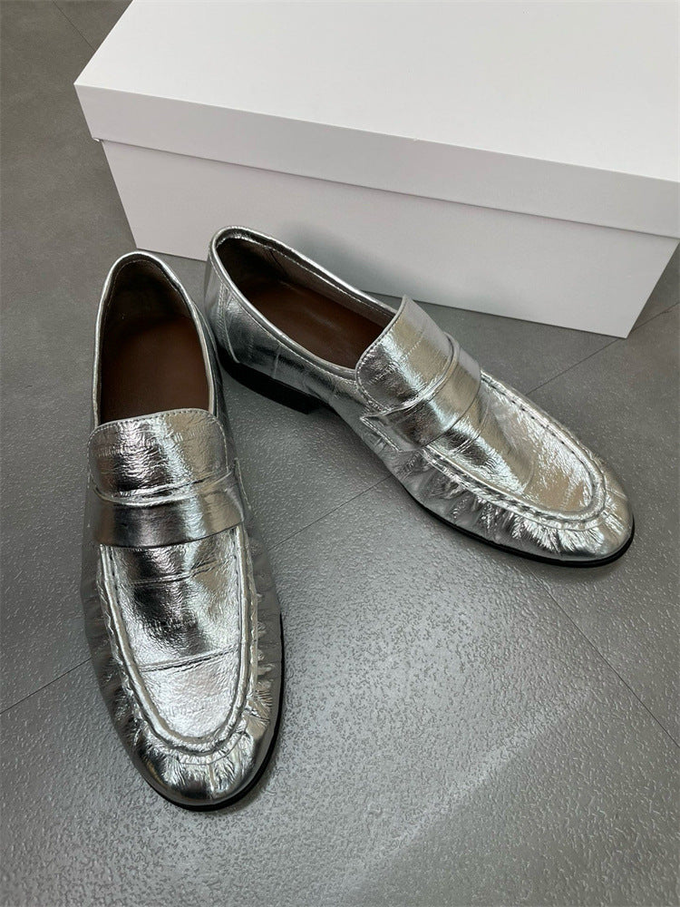 Eel skin loafers for women by Rossie Viren, stylish shoes with sleek eel skin texture and classic loafer design.