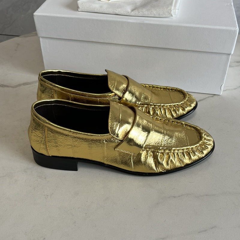 Rossie Viren eel skin loafers for women showing sleek, slip-on shoes with a smooth eel skin texture and classic design.