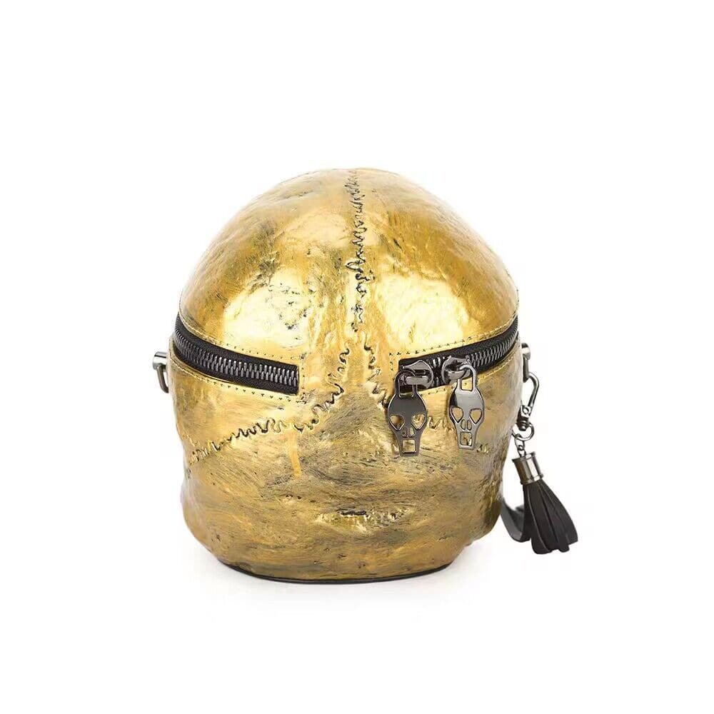 Rossie Viren 3D gold skull handle bag with crossbody strap and mini size, featuring a detailed skull design on the shoulder bag.